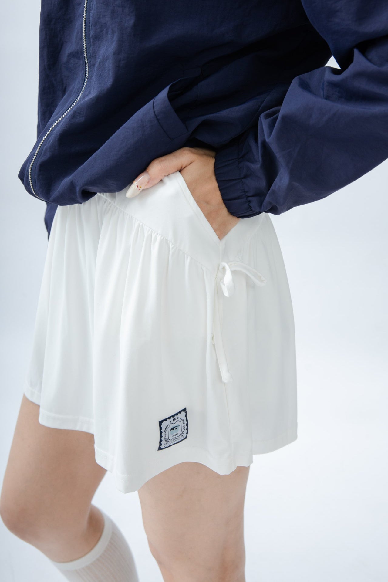 LULU Sporty Ribbon-Tie Pleated Skirt (Ivory)