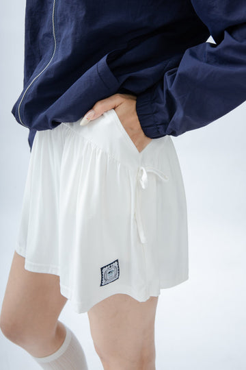 LULU Sporty Ribbon-Tie Pleated Skirt (Ivory)